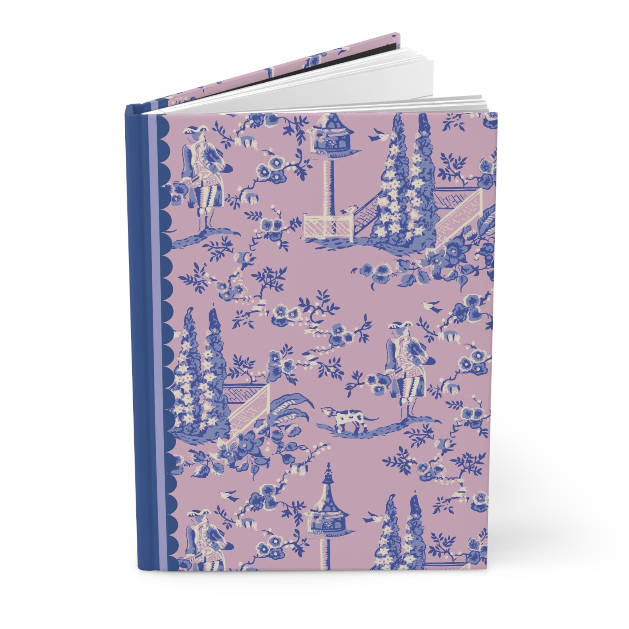 A Printify Hardcover Journal Matte with a pink and blue floral cover design featuring illustrations of gardens, trees, people, and birds, all brought to life with a matte finish.