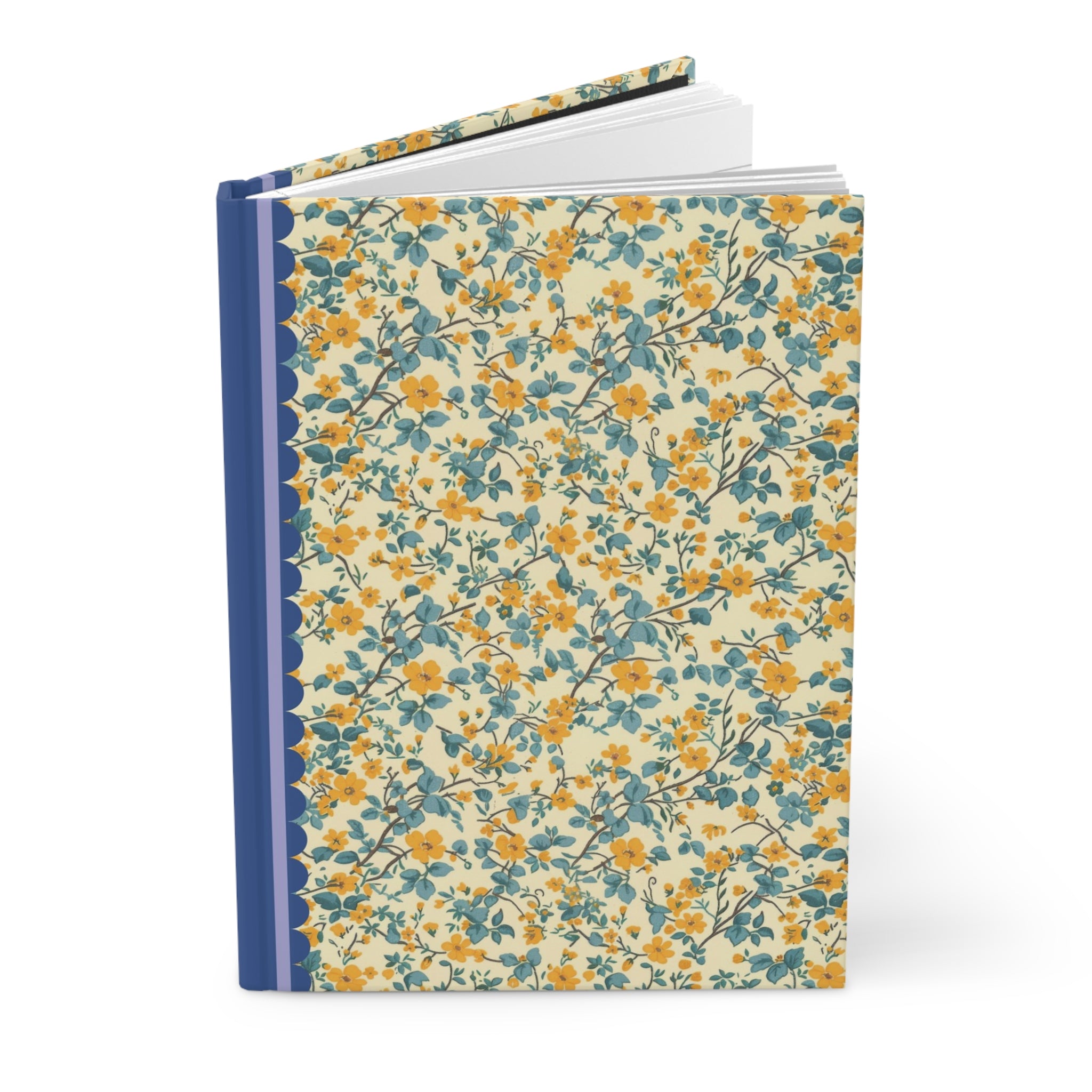 A Printify Hardcover Journal Matte with a floral patterned cover featuring blue and yellow flowers and a solid blue spine, shown partially open. Ideal as a customizable journal with lined pages, perfect for capturing thoughts and ideas.