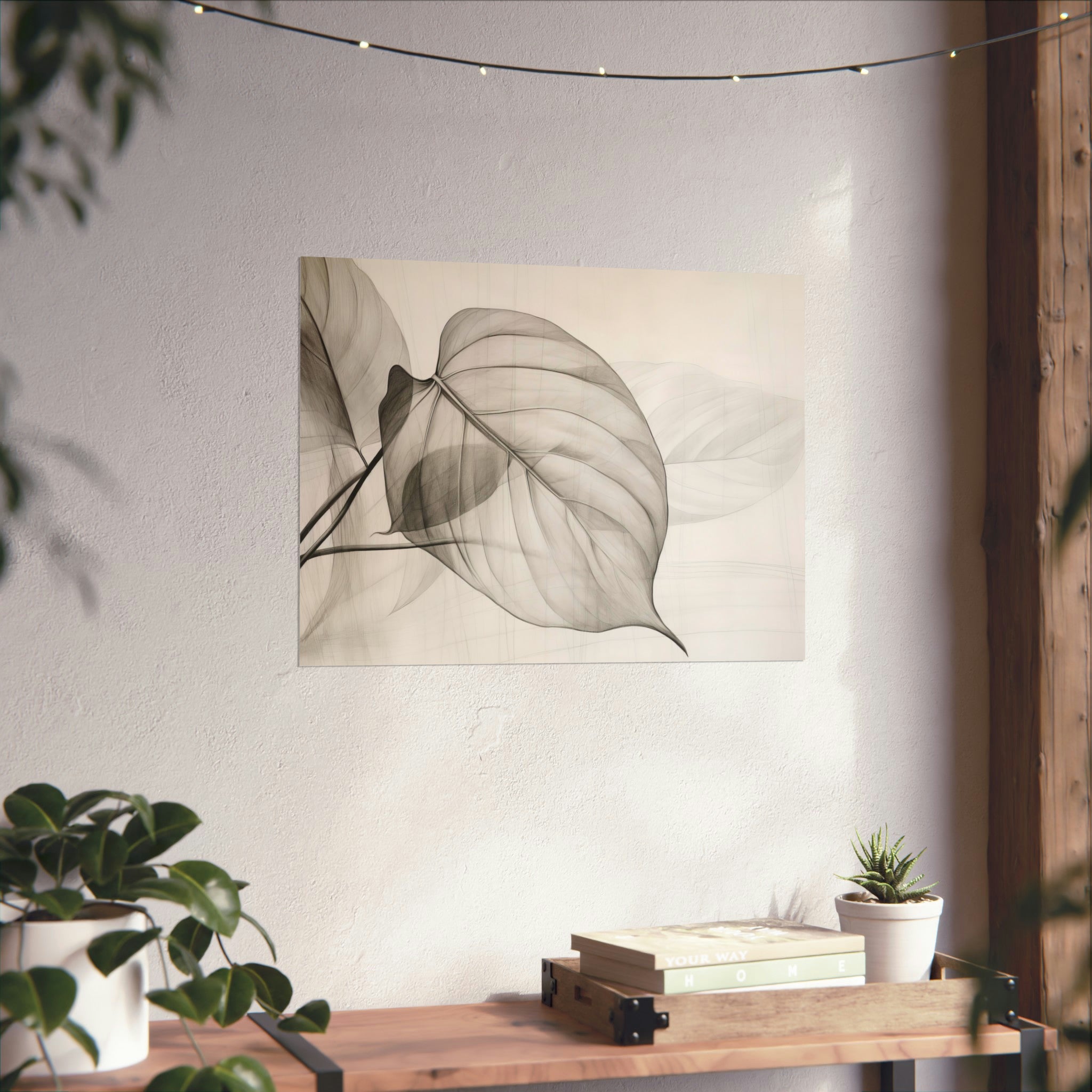 Monochrome botanical art print on archival matte paper, displayed on a white wall above a wooden shelf with books and potted plants featuring the "Leaves" Large Matte Poster available in 3 sizes by Printify.