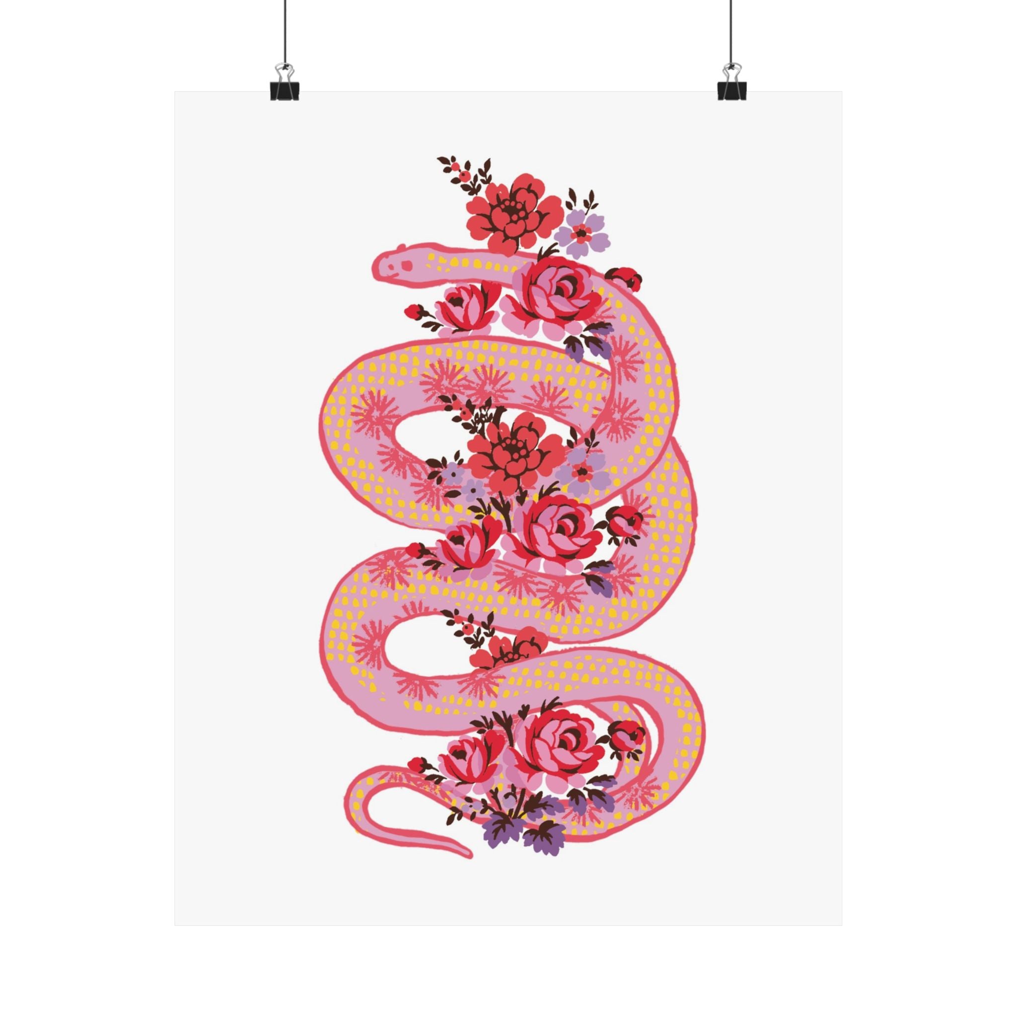 The "Snake with Roses" large matte poster by Printify features a pink and yellow snake with red and purple flowers, displayed on premium paper in 7 sizes, shown hanging by clips against a white background.