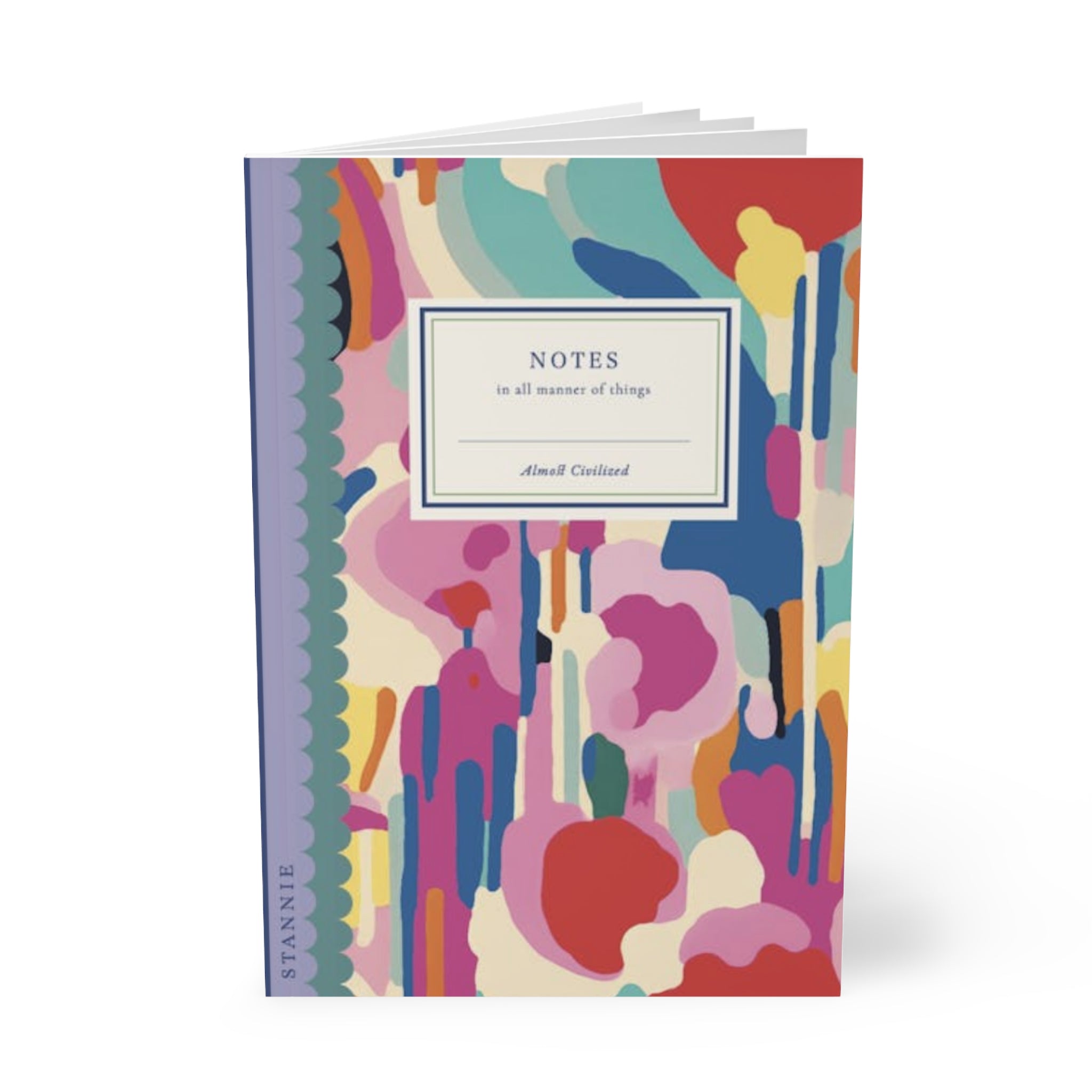 A colorful, customizable A5 notebook with an abstract design, titled "abstract Softcover Notebook, A5" by Printify. The cover features a mix of bold, bright colors with a purple spine and includes 90gsm lined paper for all your writing needs.