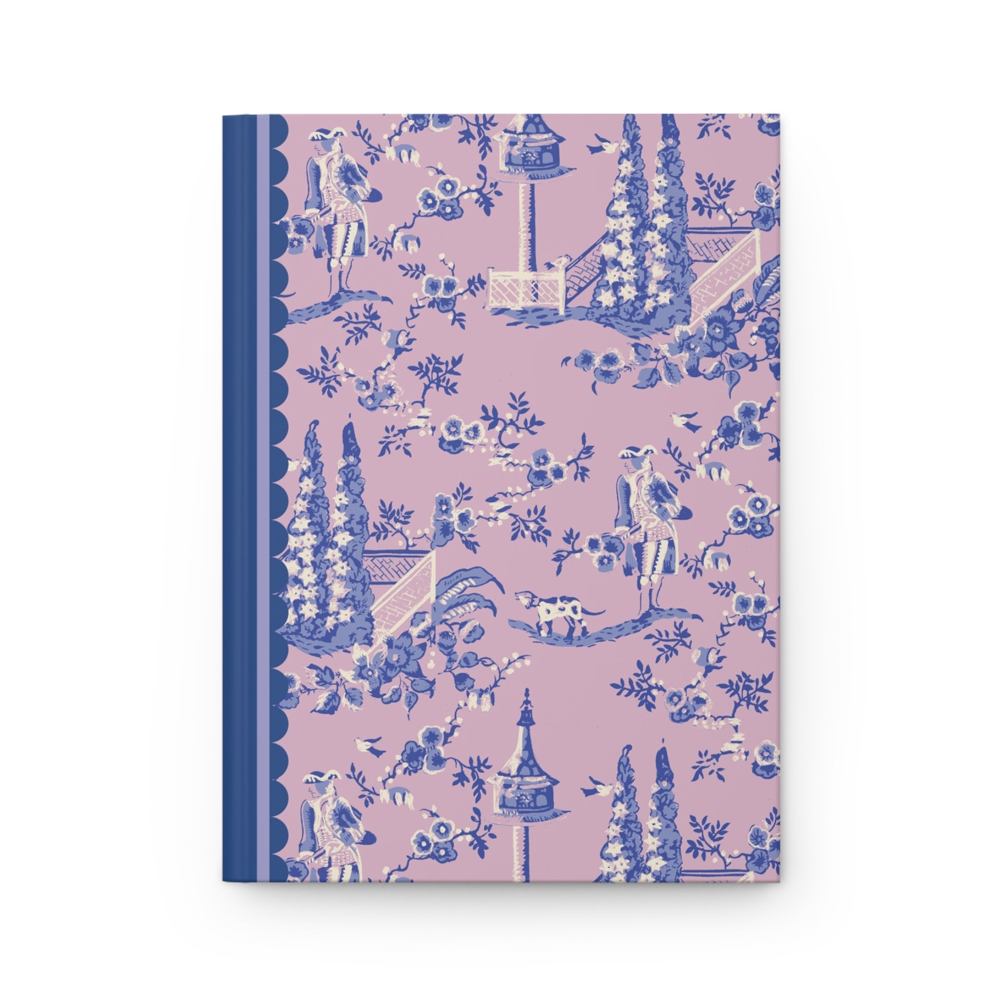 The Printify Hardcover Journal Matte features a pink and blue patterned cover with illustrations of trees, birds, flowers, and people in various activities. The spine is solid blue, the cover has a scalloped edge design, and it contains 150 lined pages.