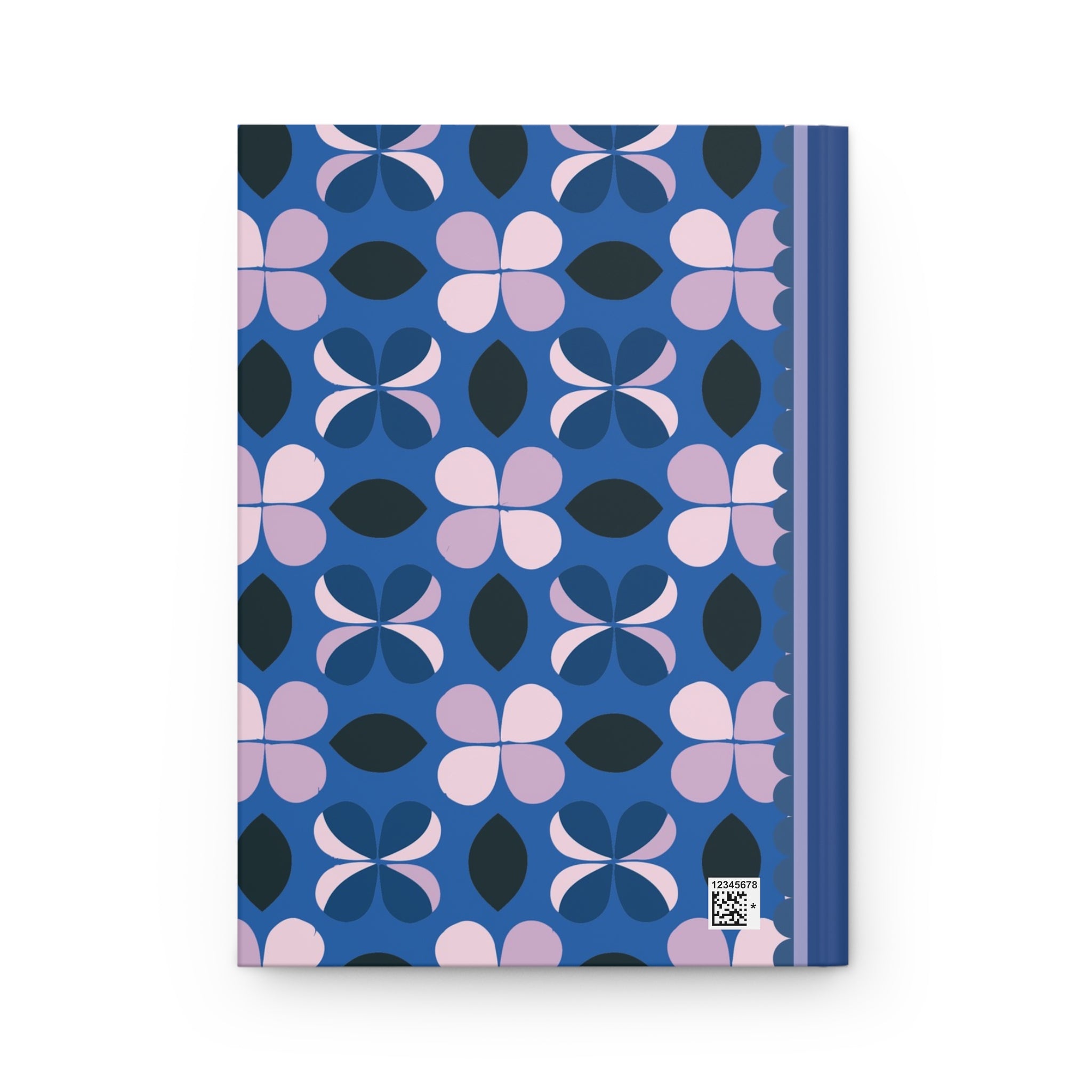 A Hardcover Journal Matte by Printify with a blue and pink geometric floral pattern cover and lined pages. A small QR code is located at the bottom right corner.