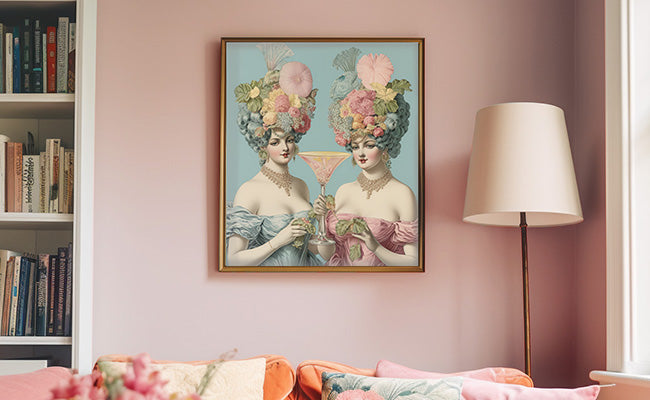 Framed artwork of two women on a pink wall