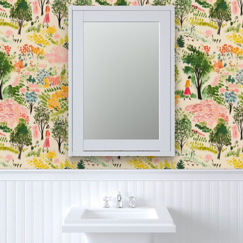 A bathroom sink with a silver faucet set against walls with Stannie & Lloyd's A Quiet Walk Wallpaper, including floral designs, and a framed mirror above it.