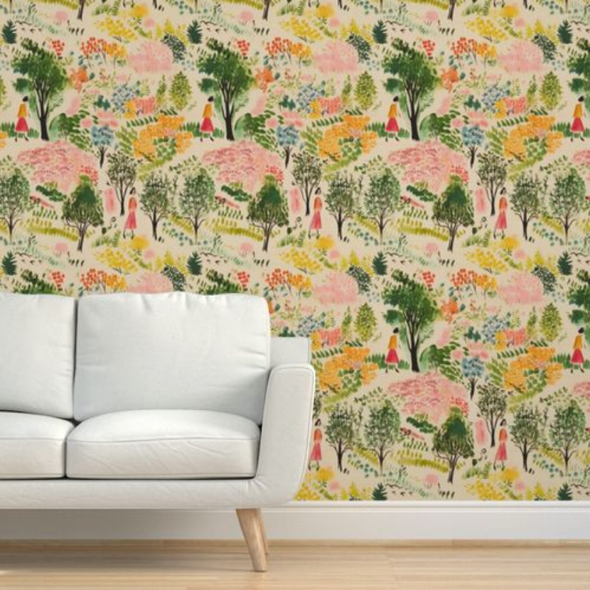 A modern living room with a white sofa against vibrant, colorful floral wallpaper from Stannie & Lloyd's A Quiet Walk Wallpaper collection and vintage art as wall decor.