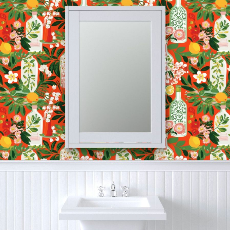 A bathroom with a red and orange floral wallpaper featuring Stannie & Lloyd Bottles in Deep Orange Wallpaper | 3 Options.