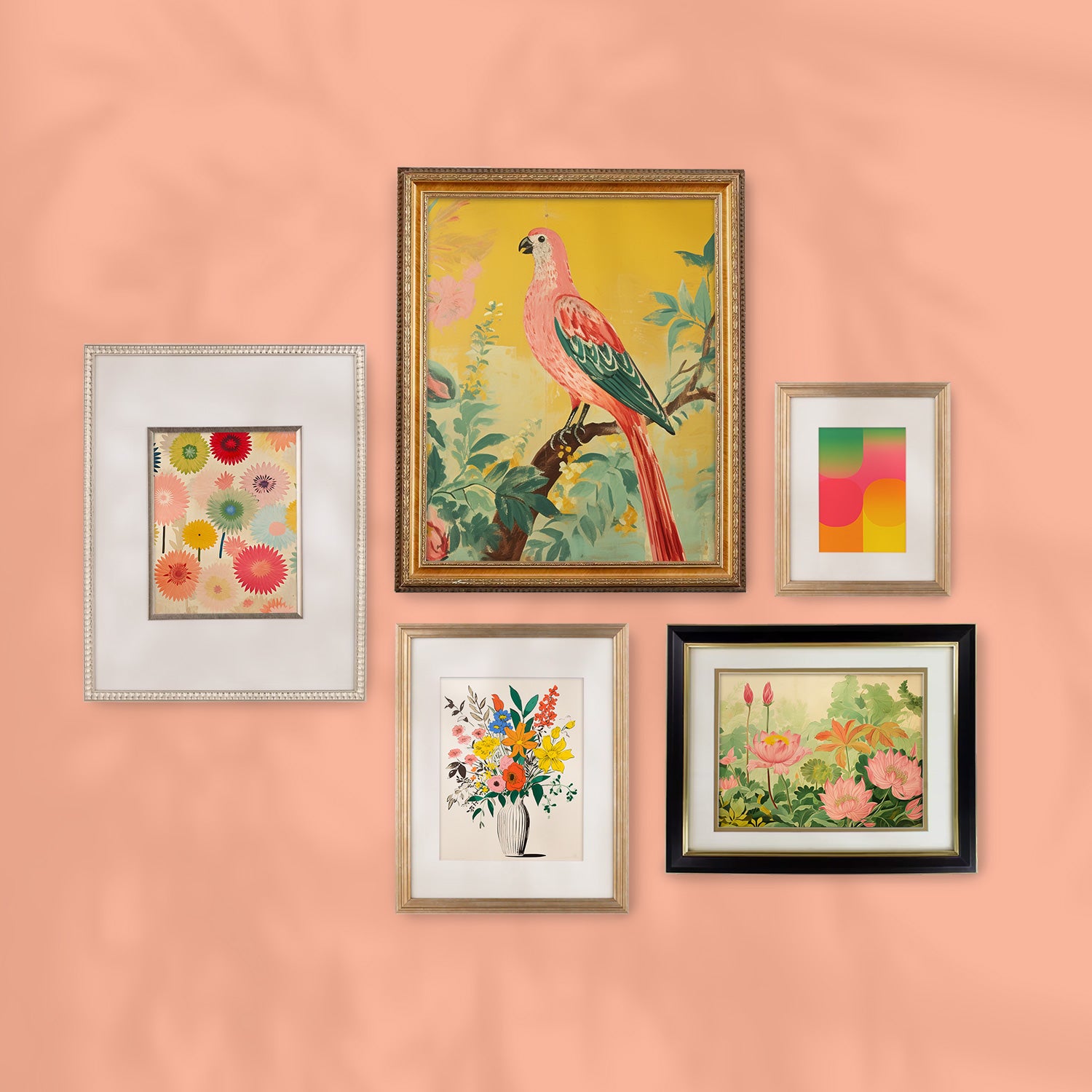 A Stannie & Lloyd gallery wall of four beautifully framed prints showcasing stunning artwork against a vibrant pink background.