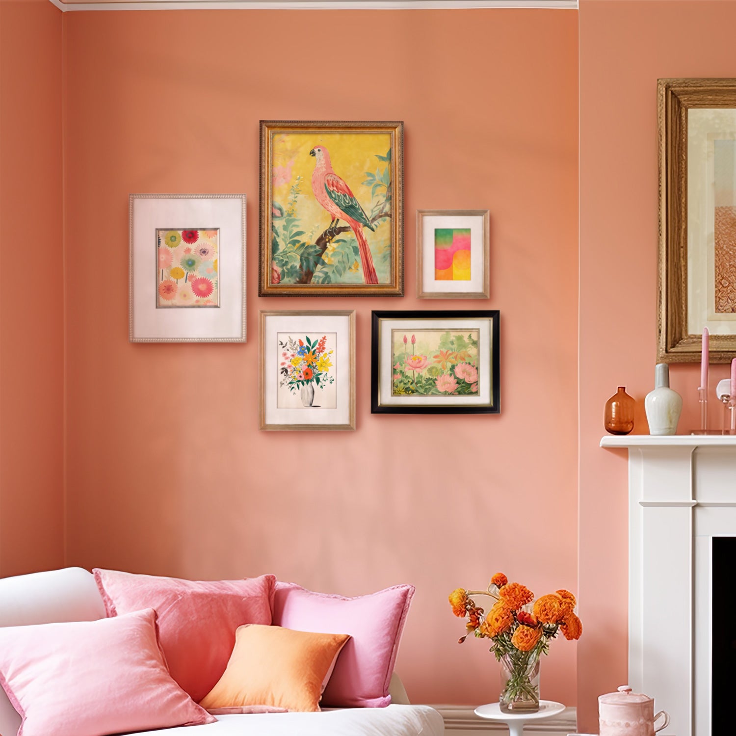 A Stannie & Lloyd gallery wall of Mod Cottage art frames in a living room with orange walls and framed pictures.