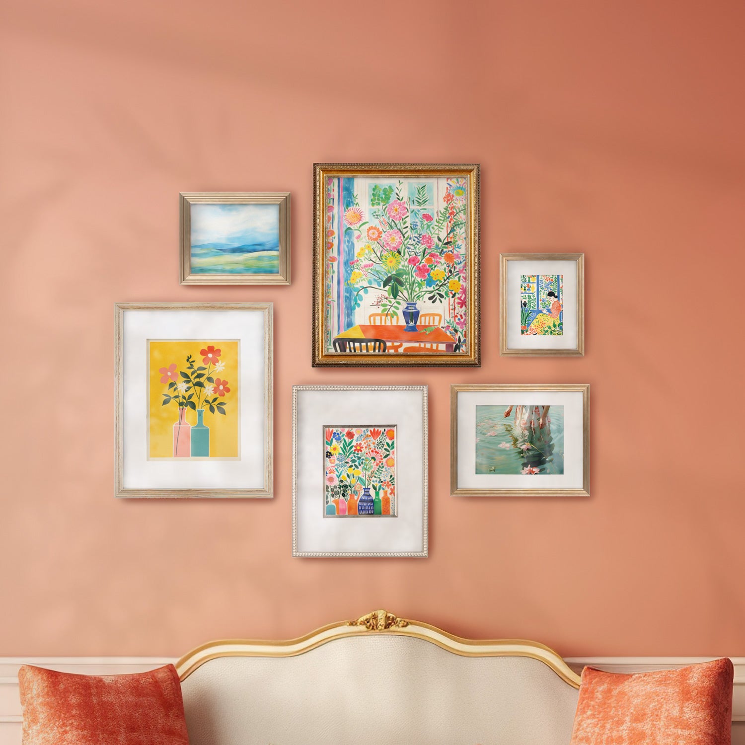 A living room featuring a Stannie & Lloyd gallery wall curated by designer Margot Wells, showcasing a mix and match of framed pictures on the wall.