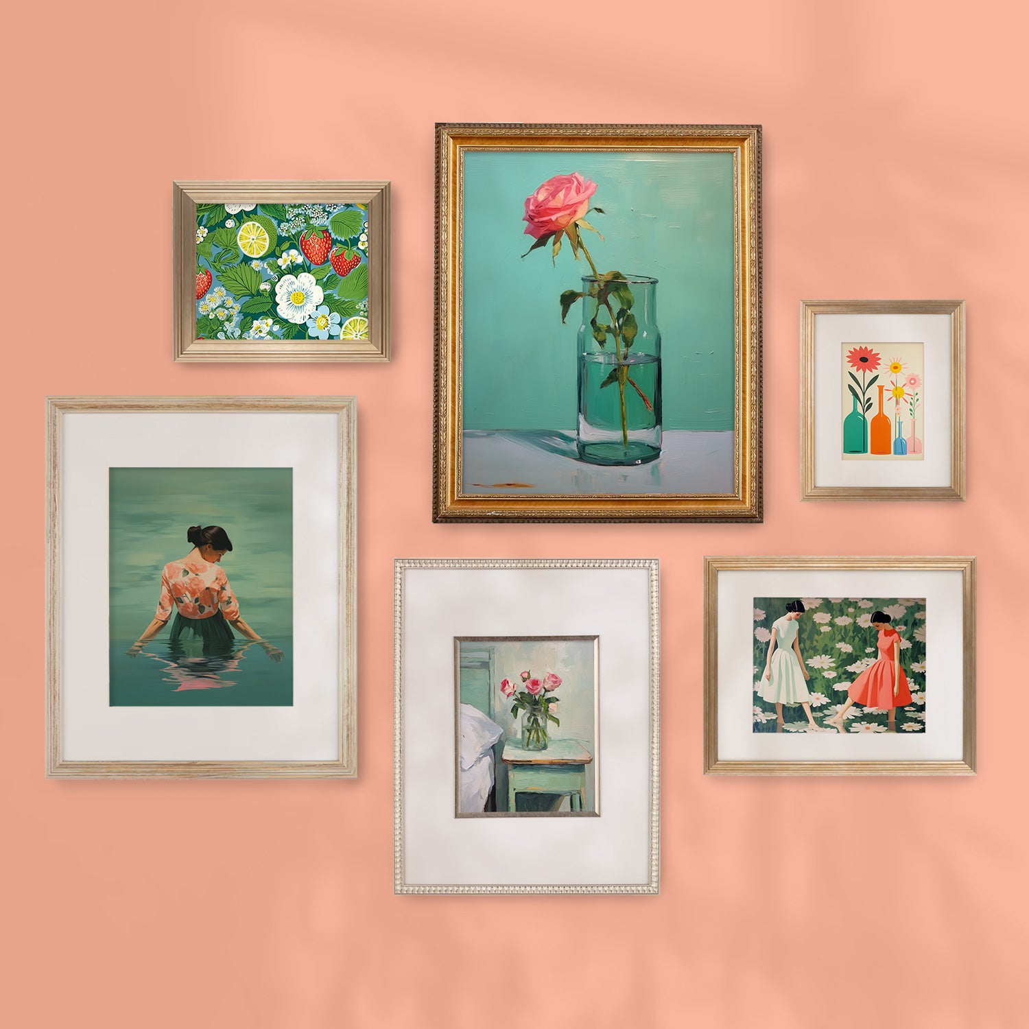 A Stannie & Lloyd gallery wall featuring a mix and match of Sweet Tart art in framed pictures on a peach wall.
